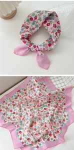 Detail of pink floral cotton linen square scarf showing intricate flower patterns