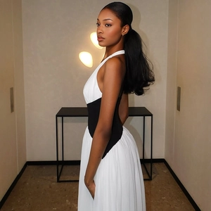 Elegant black and white halter neck maxi dress with deep V-neck and slimming waist design