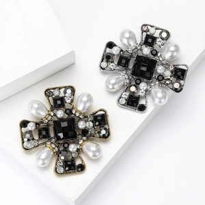 Vintage baroque cross brooches in gold and silver with black gems and white pearls