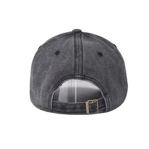 Close-up of washed denim baseball cap back with adjustable brass metal buckle detail