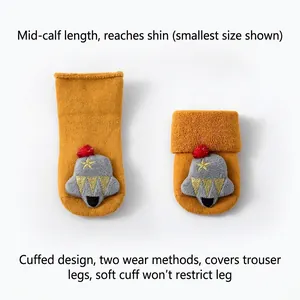 Yellow Christmas baby socks with 3D bell and star patterns in a mid-calf length design