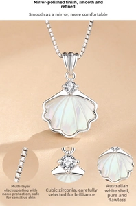 Macro shot of S925 silver necklace with shell-shaped white mother of pearl and cubic zirconia