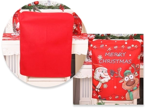Detail of red Christmas chair cover with Santa and Reindeer prints for festive dining decor