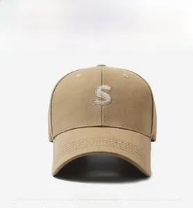 Front view of khaki baseball cap featuring white S letter embroidery and twill cotton texture