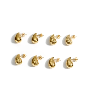 Golden teardrop earrings set with polished, quilted, and hammered textures for women