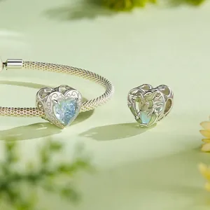 Exquisite S925 sterling silver heart charms with blue gemstones on a woven chain bracelet