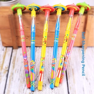 Close-up of 6 spinning top sharpener-free pencils with circus clown patterns in wooden box