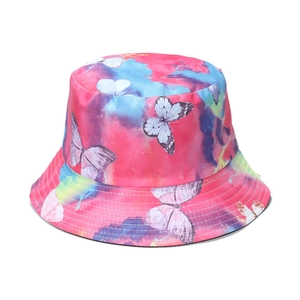 Close-up of colorful tie-dye bucket hat with detailed butterfly prints and reinforced stitching