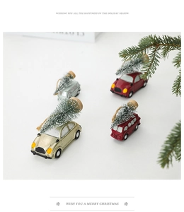 Detailed view of vintage miniature cars with snowy Christmas trees on top