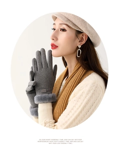 Close-up of warm winter gloves featuring faux fur cuffs and a fashion leather patch