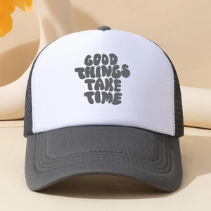 Detailed shot of mesh trucker hat featuring Good Things Take Time printed slogan