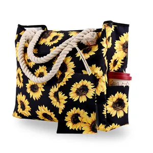 Detail view of sunflower canvas tote with cotton rope handles and side pocket