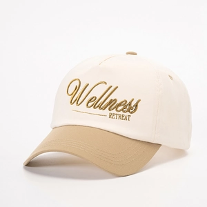 Adjustable two-tone baseball cap in off-white and khaki with Wellness embroidery