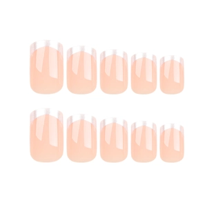 Lot de faux ongles French classiques rose nude avec pointes blanches sur fond blanc