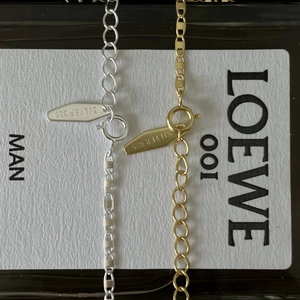 Close-up of S925 sterling silver necklaces with lobster clasp and adjustable link chain
