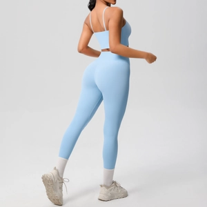 Detail of cross-back yoga top and high-waist leggings in sky blue brushed fabric