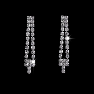Sparkling silver plated rhinestone bridal earrings in a long cross design with black background