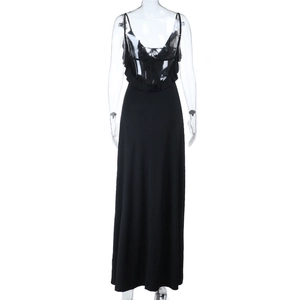 Detail of the back ruffle design and open back on this elegant black evening maxi dress