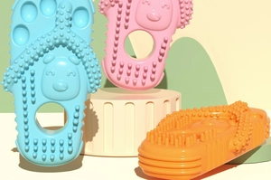 Detailed view of flip-flop shaped dog chew toys with massage textures and bear relief