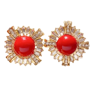 Vintage style gold and red zircon round stud earrings with white rhinestones on white background