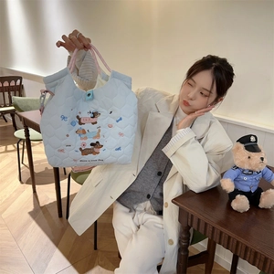 Quilted light blue tote bag featuring cute cartoon dachshund embroidery and nice text