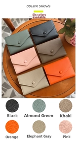 Close-up of pebble grain leather texture and snap closure on multi-color slim wallets