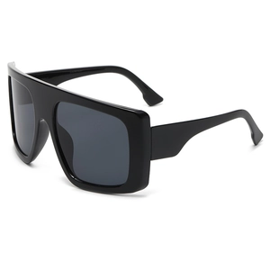 Chic oversized flat top black sunglasses for women with wide temples on white background
