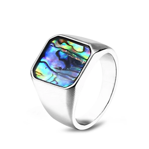 Macro detail of square stainless steel ring with colorful abalone shell inlay