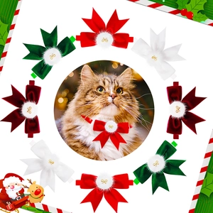 Close-up of festive pet bowties with velvet texture and golden bow accents for cats
