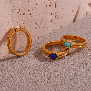 Detailed view of three 18K gold plated rings with natural gemstones and white pearl