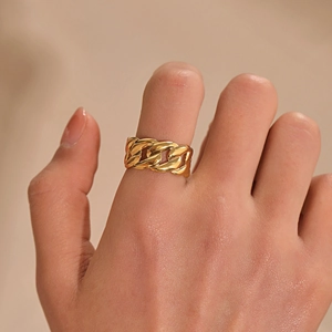 Gold stainless steel Cuban link chain ring worn on finger, minimalist chunky jewelry