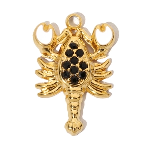 Close-up of golden metal scorpion pendant inlaid with black round cubic zirconia stones