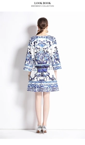 Rear view detail of blue porcelain print dress with bell sleeves and zipper closure