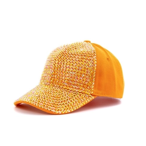 Detailed side view of orange baseball cap with shimmering golden rhinestones on the brim
