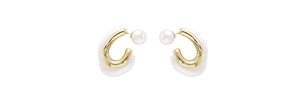 Detail of irregular geometric earrings with cream acrylic and gold-tone metal and pearl