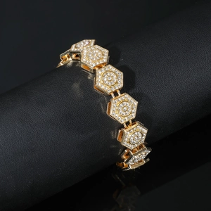 Hip hop gold bracelet featuring diamond-encrusted hexagonal links on a display stand
