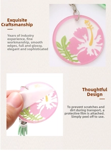 Detail showing removal of protective film from floral acrylic keychain with green tassel