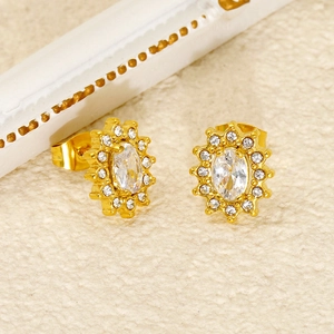 Detailed close-up of a gold sunflower stud earring with sparkling cubic zirconia crystals
