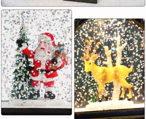 Close-up of LED Christmas snow globe lantern with Santa and reindeer glitter scene