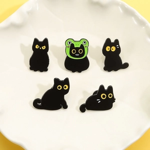 Set of 5 cute black cat enamel pins featuring various expressions and a green frog hat