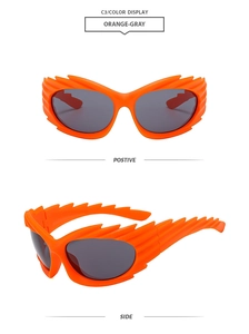 Front and side view of orange Y2K sunglasses with flame shaped frames and gray lenses