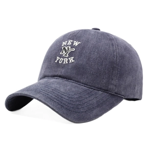 Vintage washed navy blue baseball cap featuring white New York embroidery in retro street style