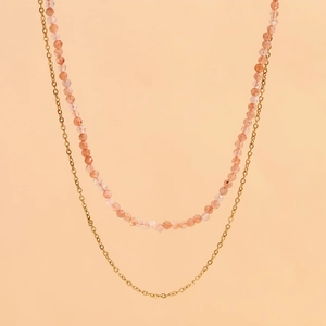 Detail view of 18K gold plated double-layer necklace with pink sunstone beaded chain