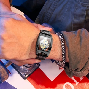 Men's tonneau mechanical watch with skeleton dial, black leather strap and luminous hands
