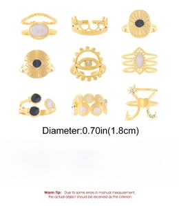 Detailed view of nine gold stainless steel rings with diameter and weight specifications