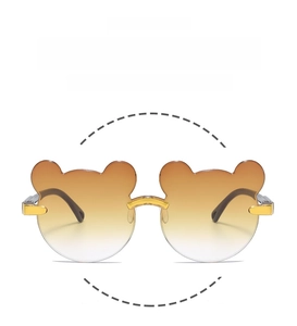 Detailed view of bear-shaped gradient lenses with metallic bridges for kids sunglasses