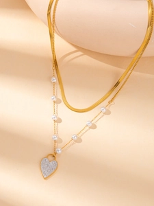 Double-layered gold titanium steel necklace with pearl and heart-shaped pavé pendant