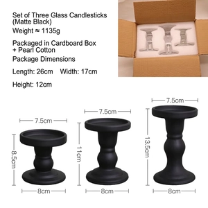 Set of three matte black Roman column glass candle holders in different heights