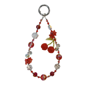 Beaded cherry phone charm keychain with red crystal beads and floral accents