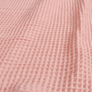 Pink cotton waffle weave nursing cover with breathable honeycomb texture for newborns